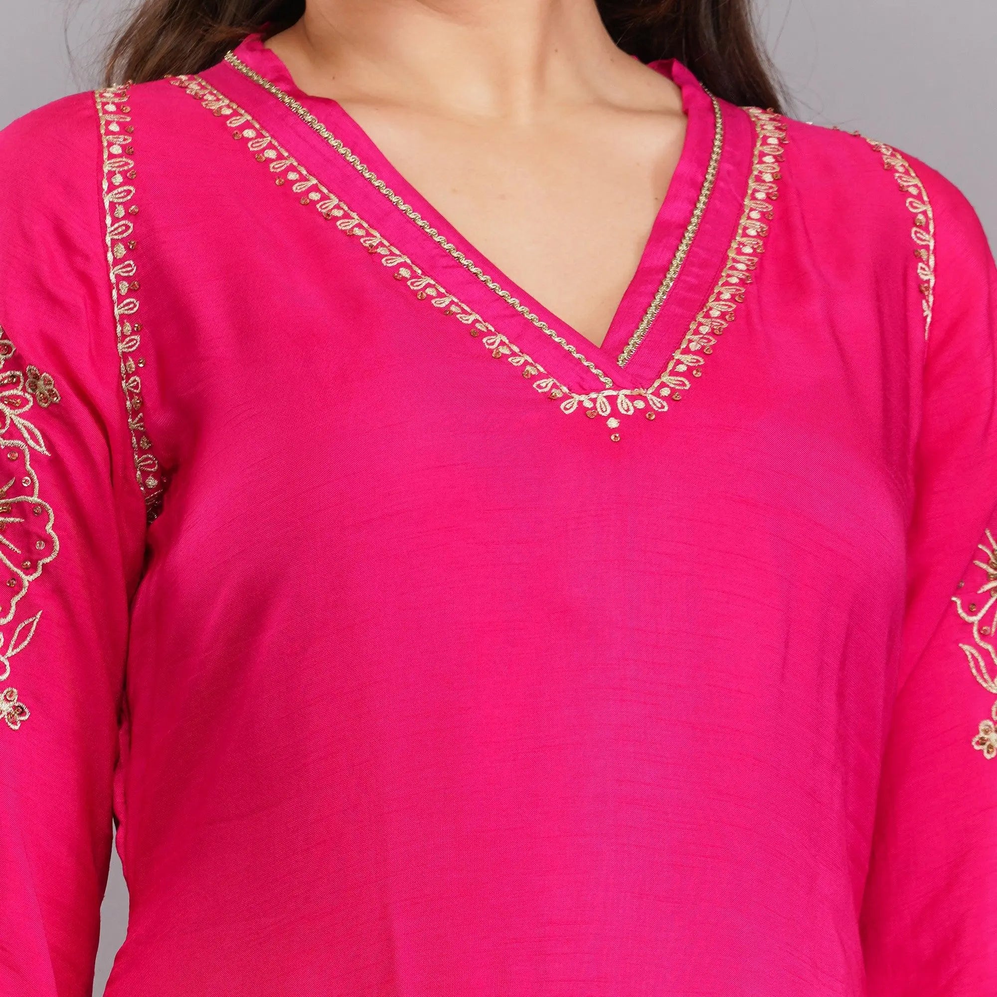 Graceful zari suits with v-neck